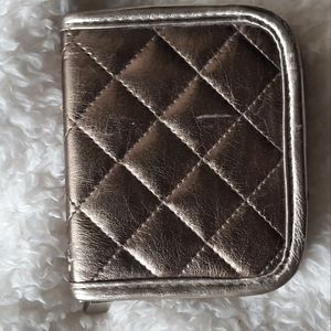 Zip wallet/change purse, metallic gold, two-sided with pink satin-like interior.